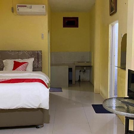 Отель Oyo 3050 Hotasi Seaview Syariah Аньер Экстерьер фото