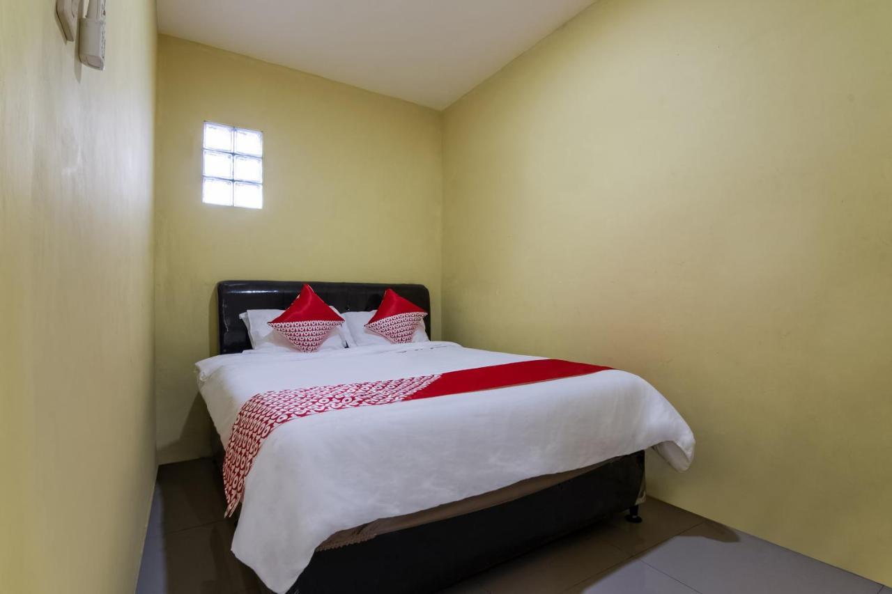 Отель Oyo 3050 Hotasi Seaview Syariah Аньер Экстерьер фото