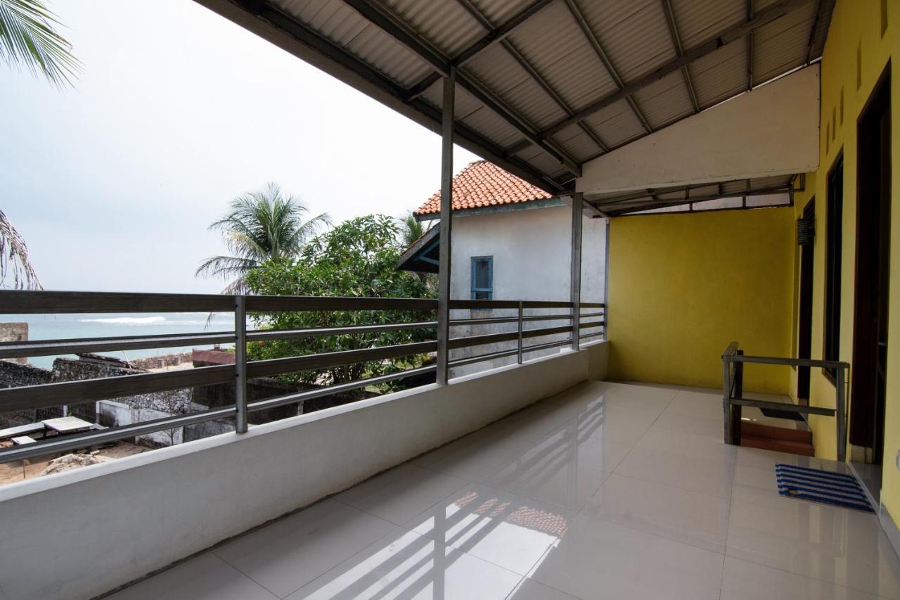 Отель Oyo 3050 Hotasi Seaview Syariah Аньер Экстерьер фото