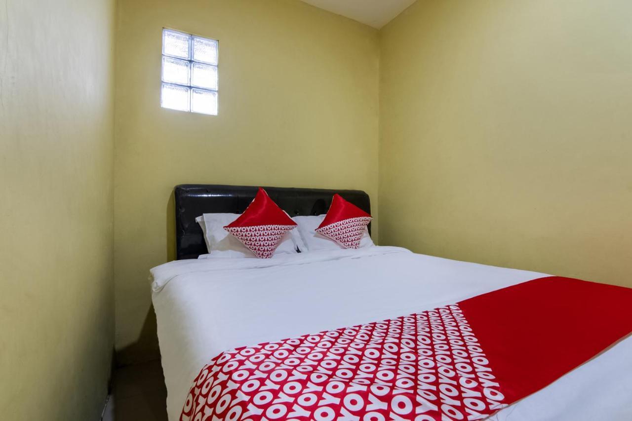Отель Oyo 3050 Hotasi Seaview Syariah Аньер Экстерьер фото