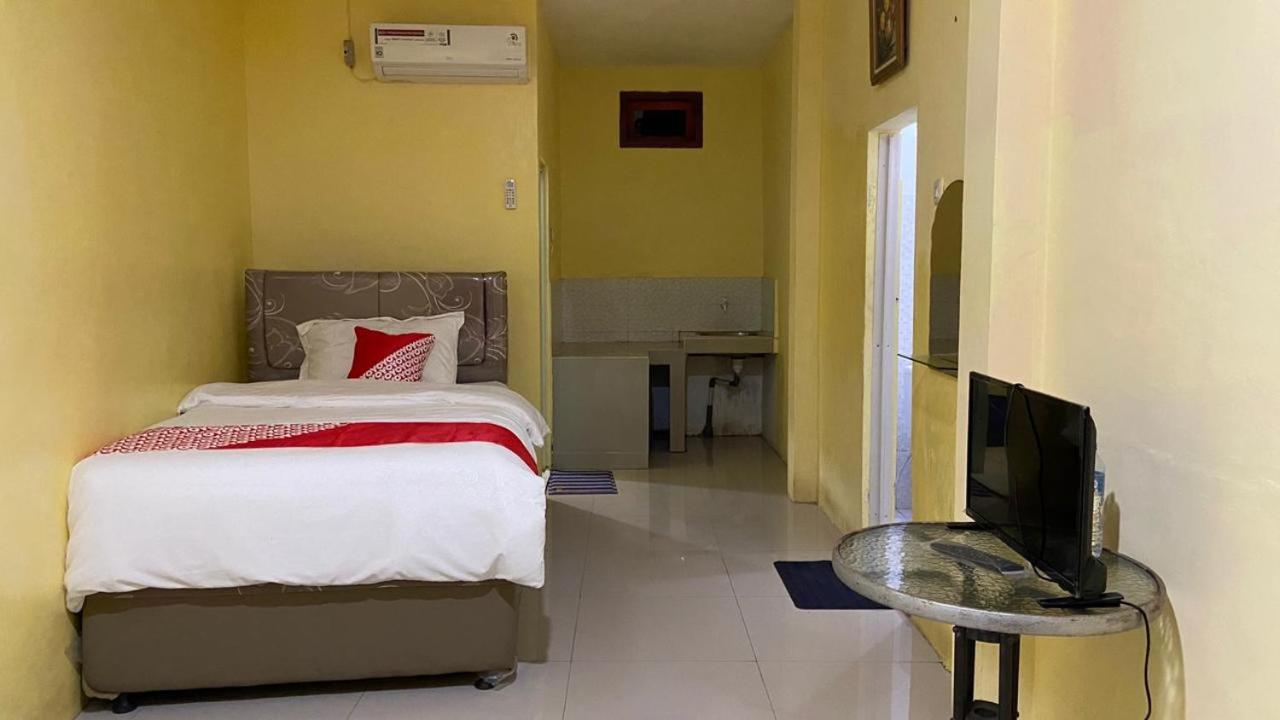 Отель Oyo 3050 Hotasi Seaview Syariah Аньер Экстерьер фото