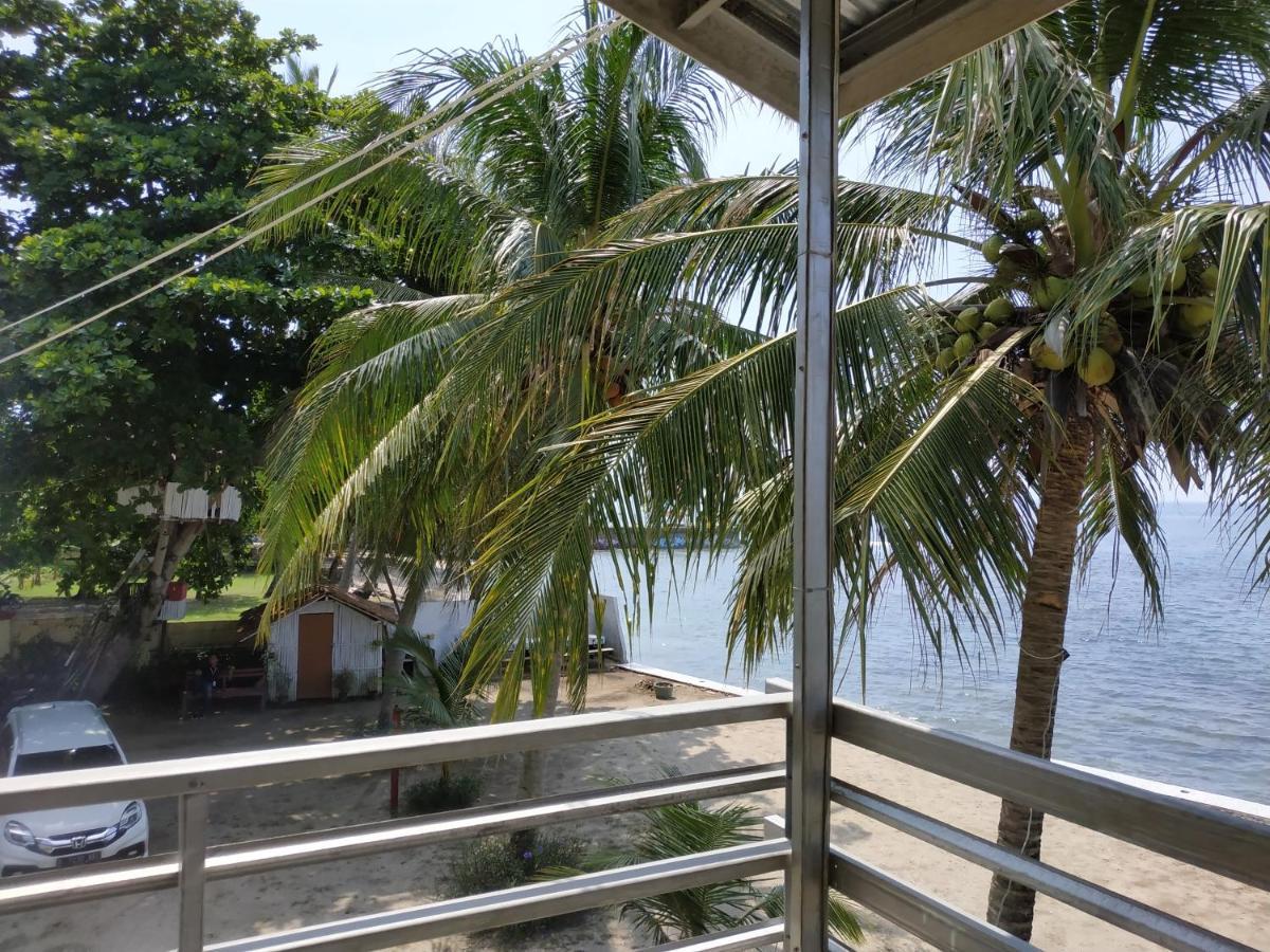 Отель Oyo 3050 Hotasi Seaview Syariah Аньер Экстерьер фото