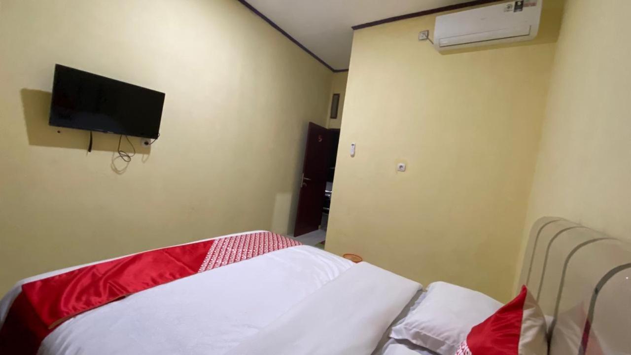 Отель Oyo 3050 Hotasi Seaview Syariah Аньер Экстерьер фото