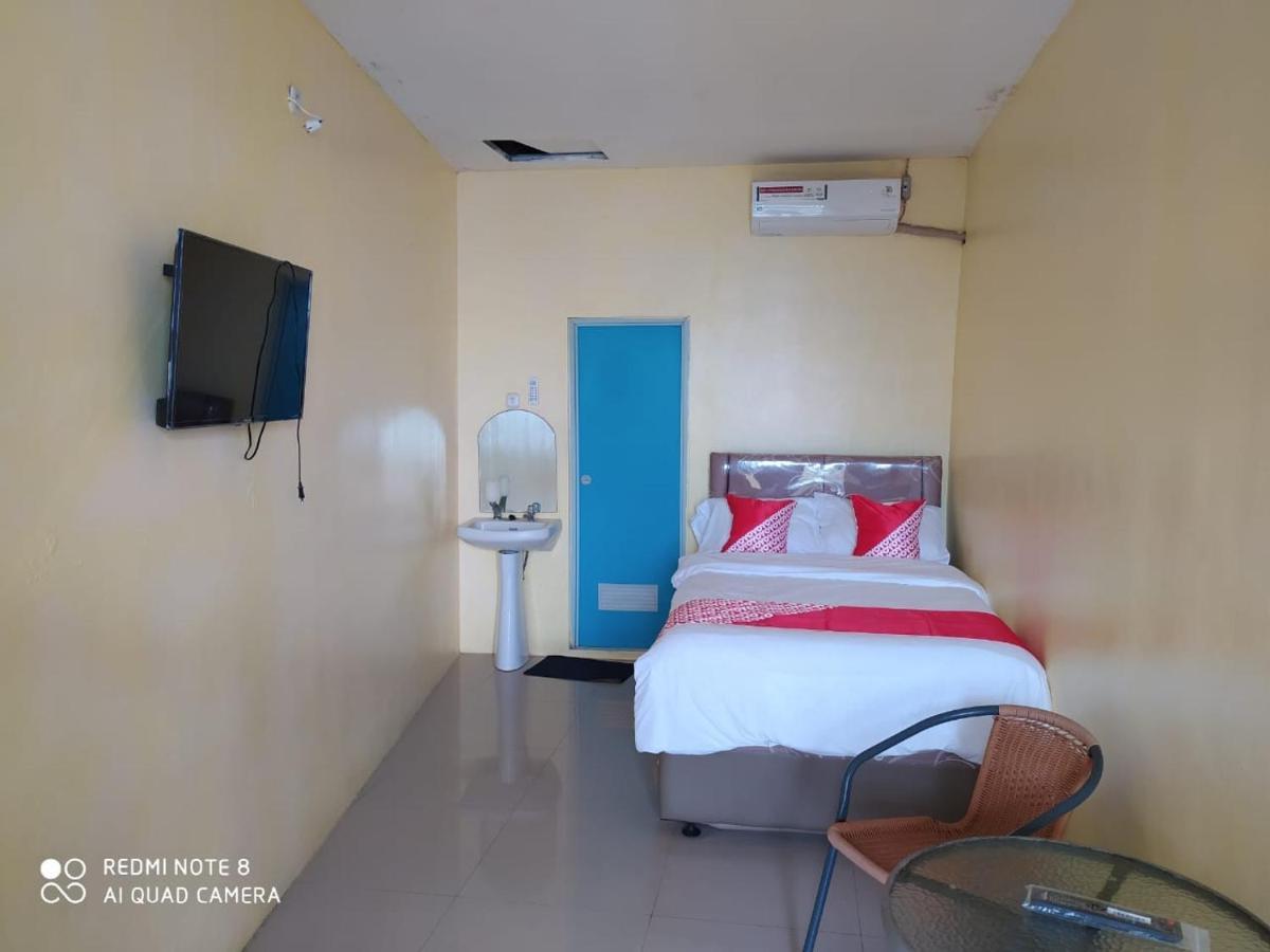 Отель Oyo 3050 Hotasi Seaview Syariah Аньер Экстерьер фото